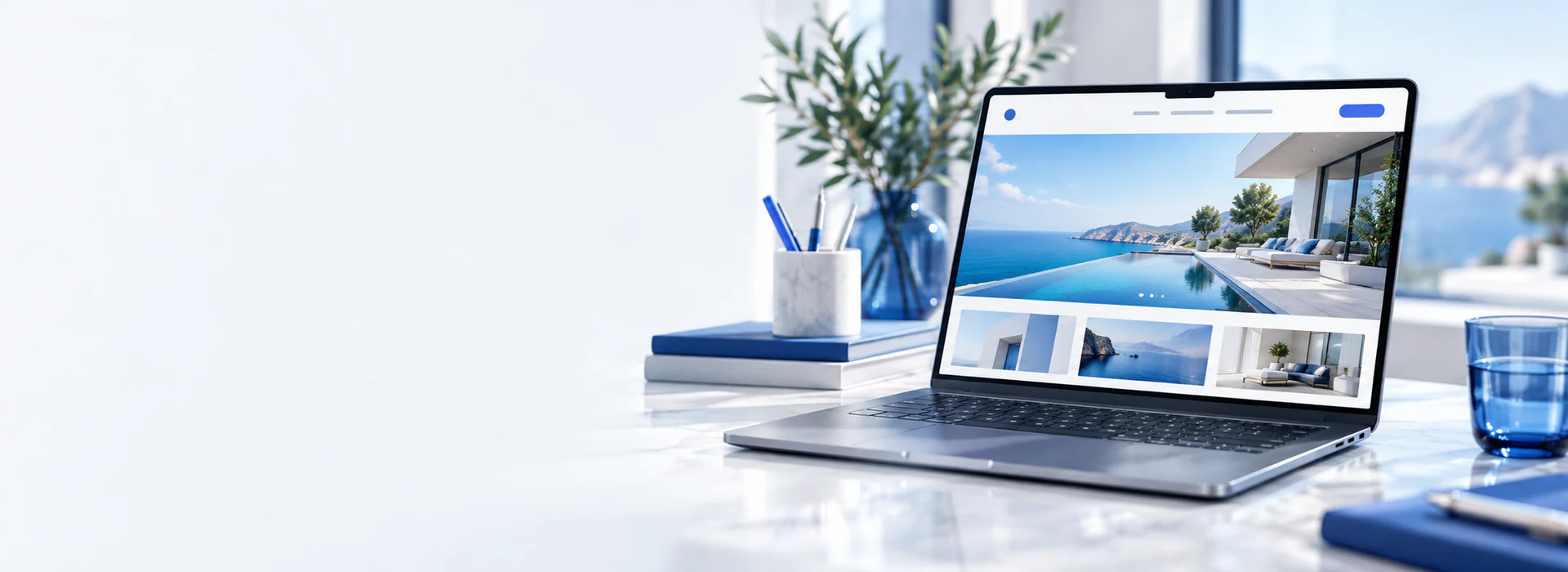 Slim laptop showing beautiful visual business website on pale desk, architectural blue accents